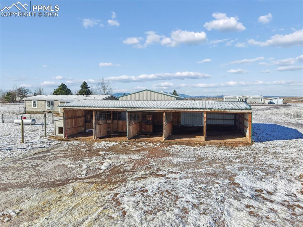 6315 Peerless Farms Road Peyton, CO 80831 - Photo 42 of 49 a front view of a house with a yard