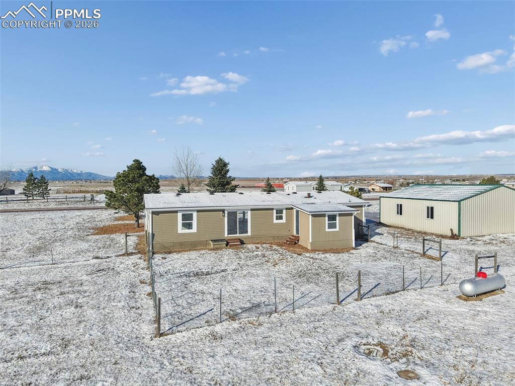 6315 Peerless Farms Road Peyton, CO 80831 - Photo 47 of 49 a view of a terrace with chairs