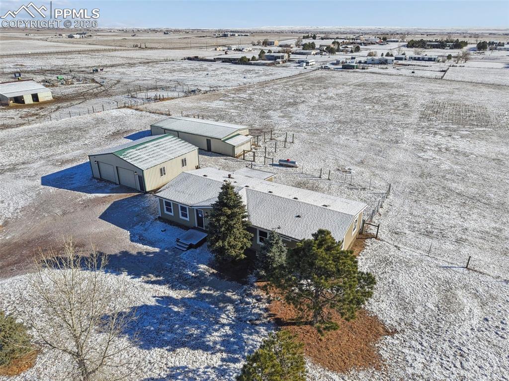 6315 Peerless Farms Road Peyton, CO 80831 - Photo 5 of 49 a aerial view of a house with a yard