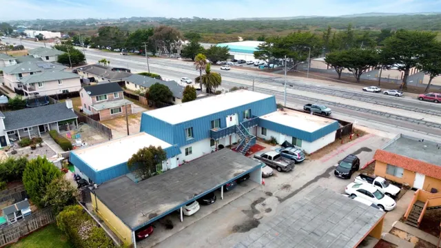 an aerial view of a house with a big yard