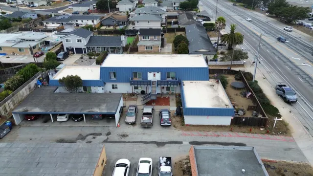 an aerial view of a house with parking space