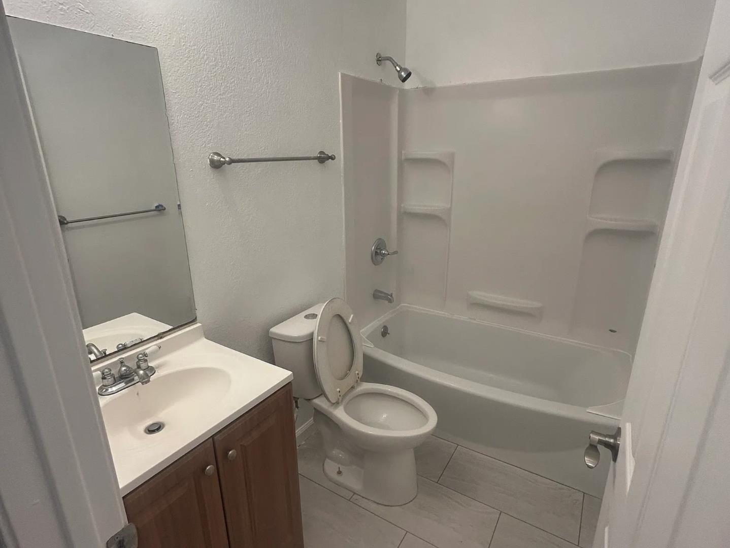 470 Reservation Road Marina, CA 93933 - Photo 6 of 8 a bathroom with a sink a toilet and a bathtub