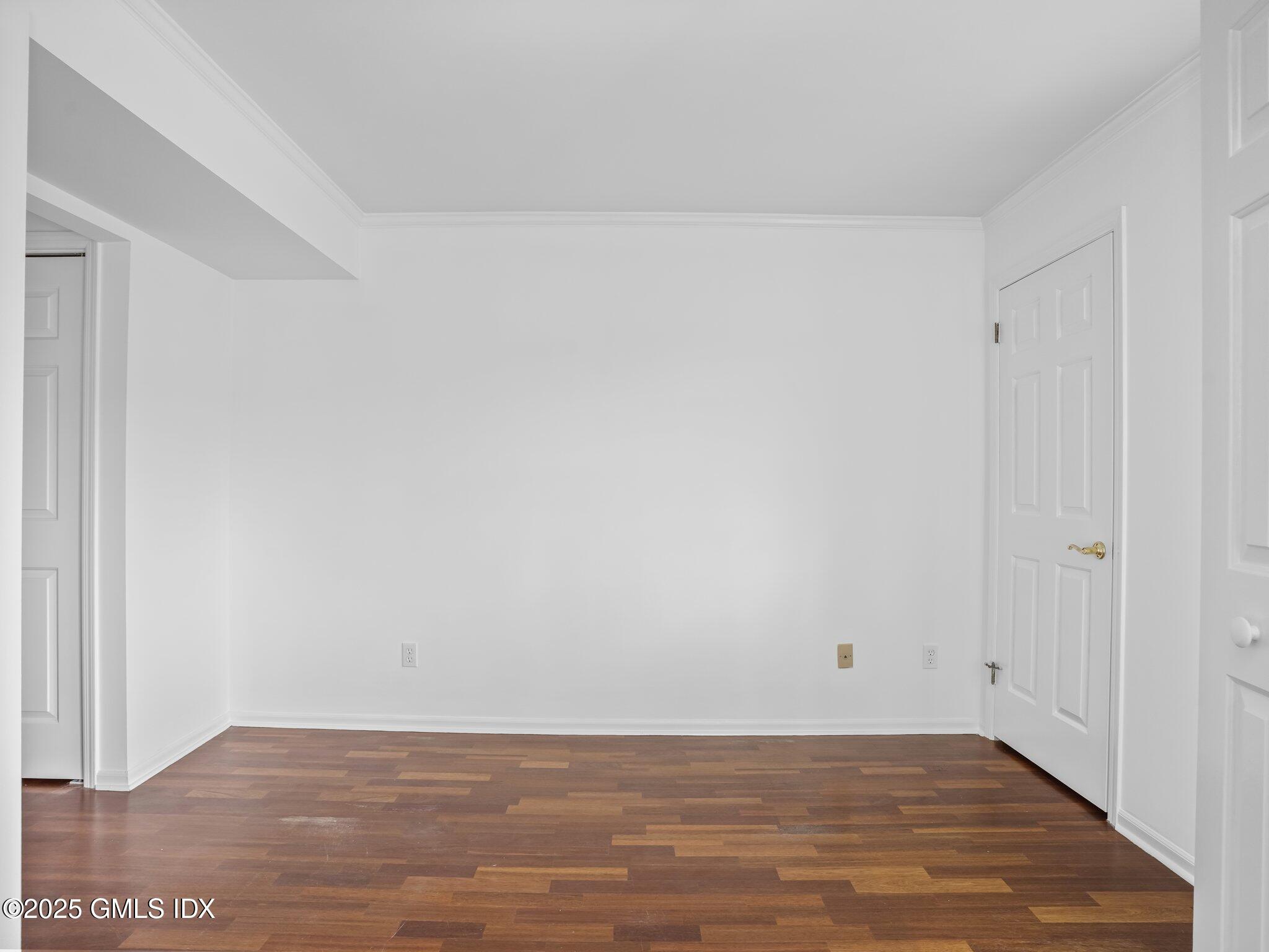 351 Pemberwick Road, Unit 205 Greenwich, CT 06831 - Photo 11 of 12 a view of a room with wooden floor