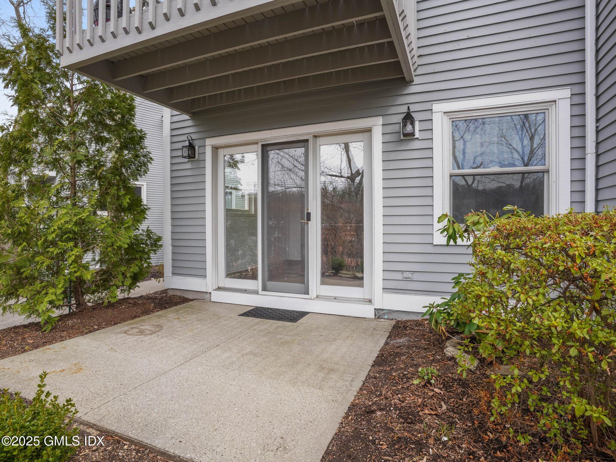 351 Pemberwick Road, Unit 205 Greenwich, CT 06831 - Photo 12 of 12 a view of a backyard of the house