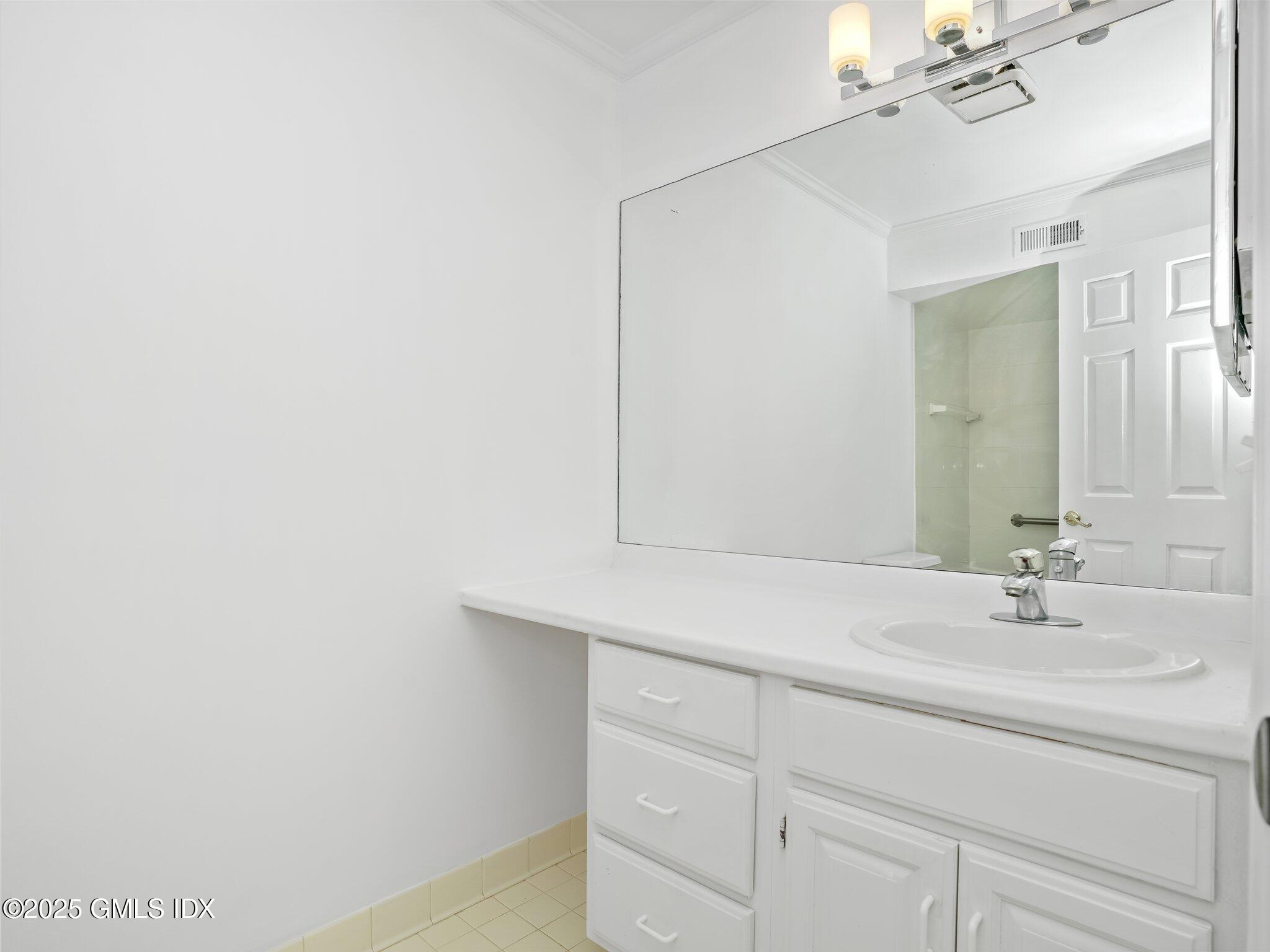 351 Pemberwick Road, Unit 205 Greenwich, CT 06831 - Photo 9 of 12 a bathroom with a sink and a mirror
