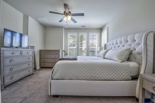 a bedroom with a bed and window