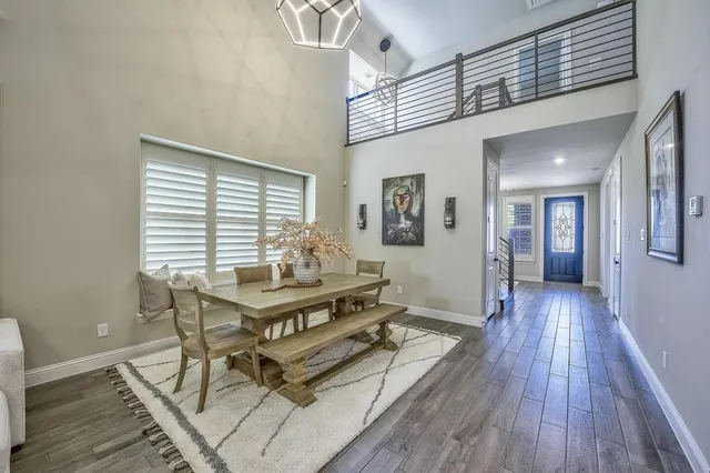 a workspace with wooden floor and furniture