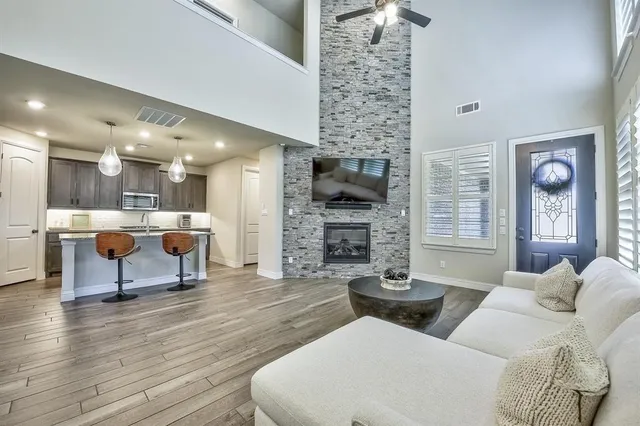 a living room with furniture and a fireplace