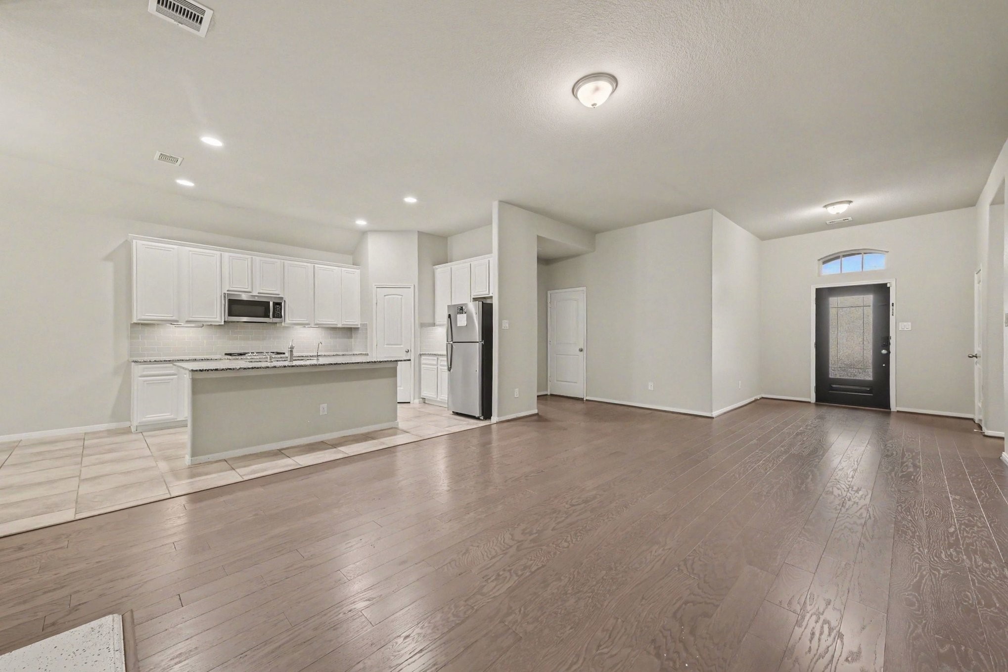 24554 Grayson Falls Lane Spring, TX 77389 - Photo 7 of 27 a view of kitchen with wooden floor