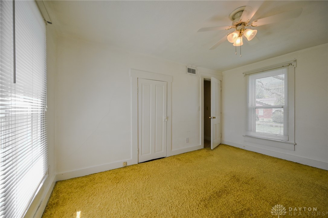 3057 Springfield Xenia Road Springfield, OH 45506 - Photo 4 of 37 This bright room features abundant natural light and soft carpeting, creating a welcoming atmosphere.