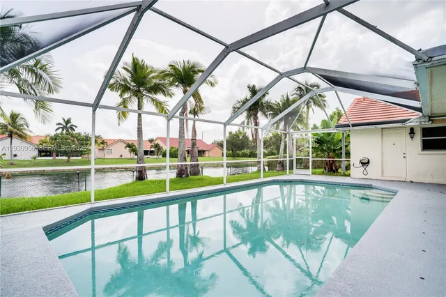 a view of a swimming pool with a patio