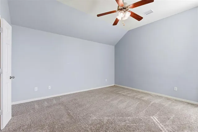 a view of storage and utility room with closet