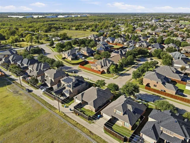an aerial view of a house with a ocean view