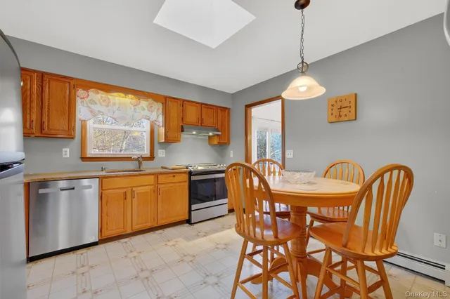 a view of a dining room with furniture window and outside view