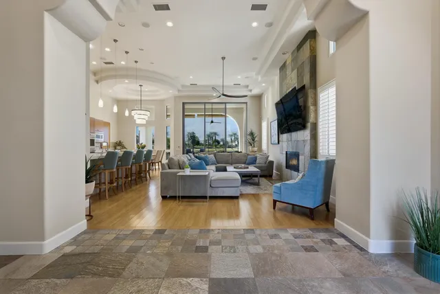 a lobby with furniture and a potted plant
