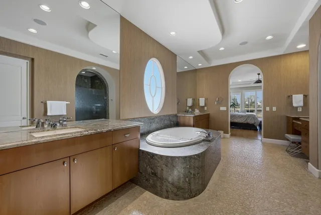 a bedroom with bed and a flat screen tv