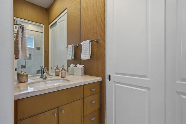 a bedroom with a bed and a table