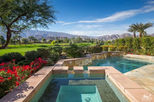 a view of a lake with a garden