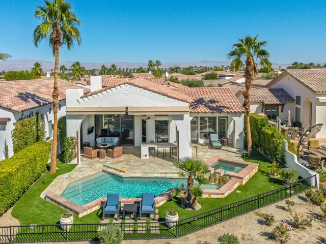 an aerial view of a house with a garden