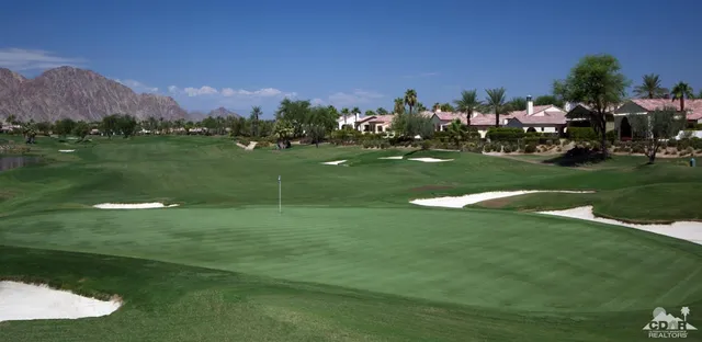 a view of a golf course with a lake