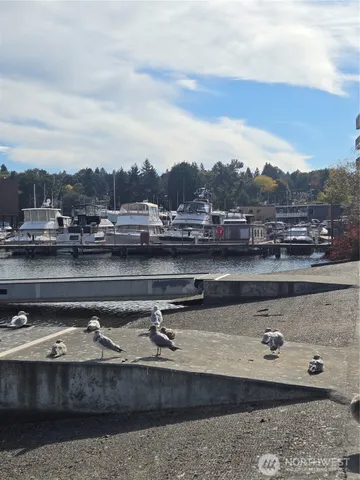 a view of swimming pool with outdoor seating