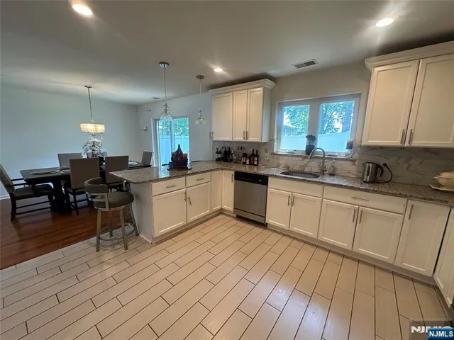 a kitchen with a sink and cabinets