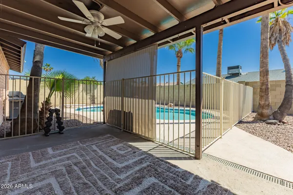 a view of a house with backyard porch and sitting area