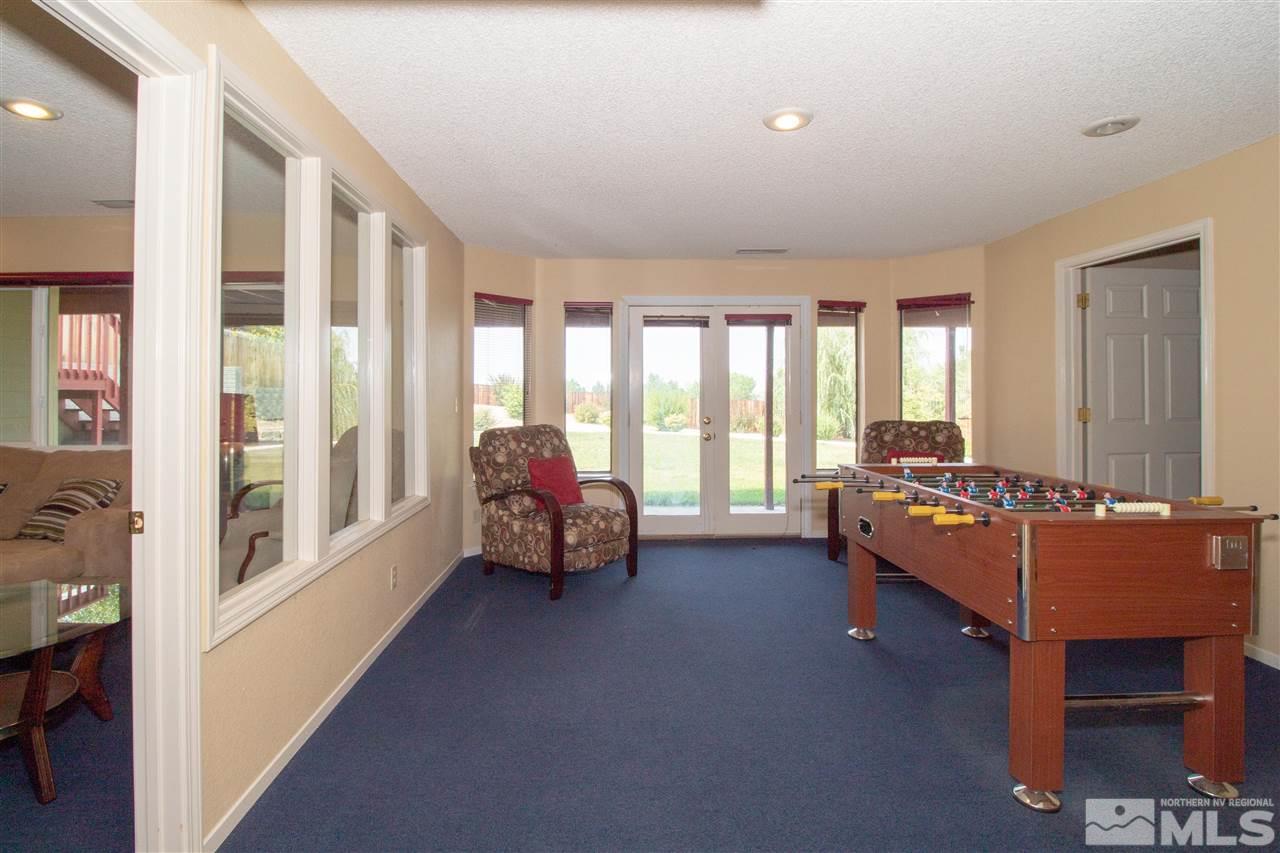 13335 Rim Rock Drive Reno, NV 89521 - Photo 17 of 25 a bedroom with furniture and large windows
