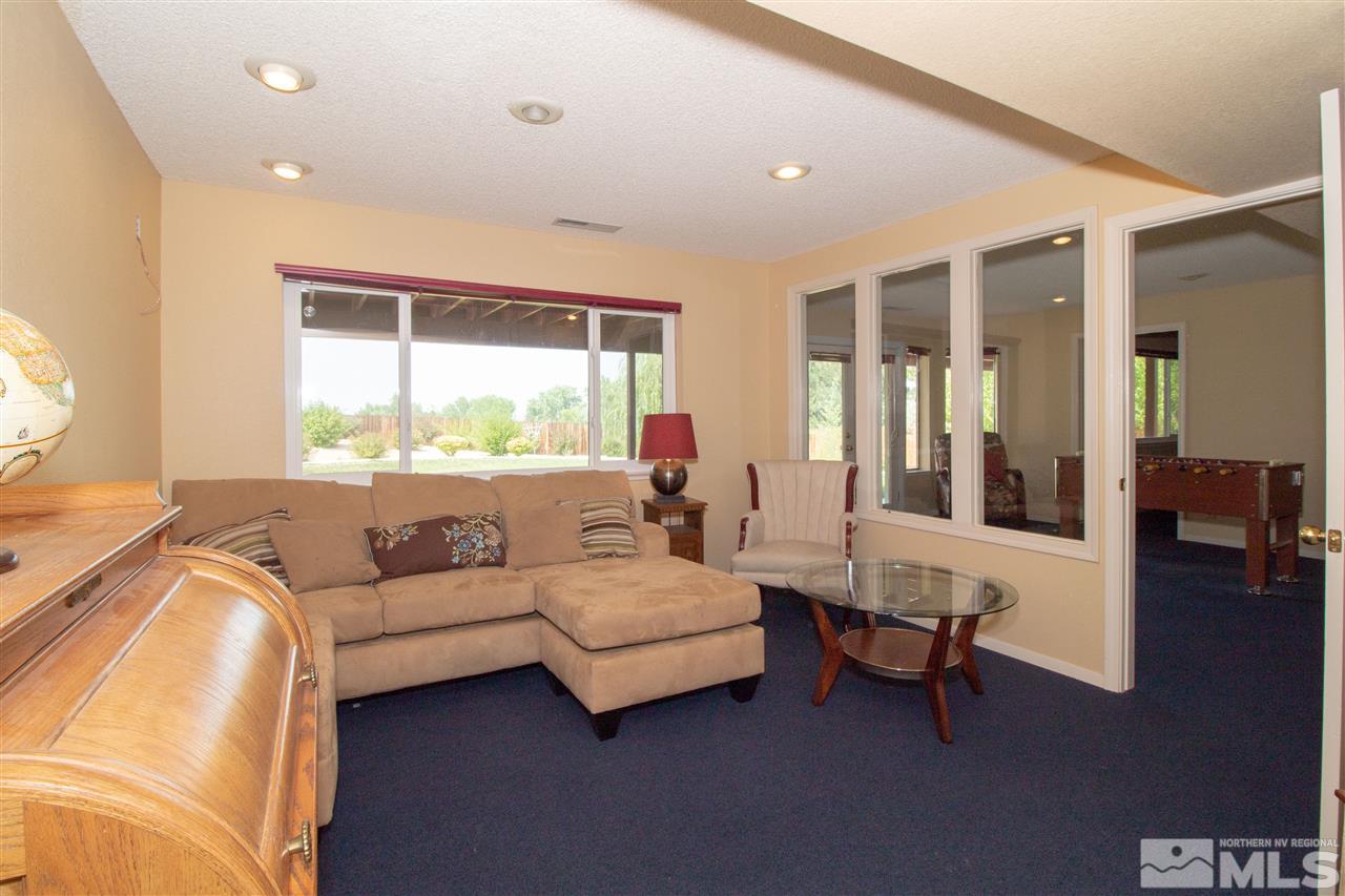 13335 Rim Rock Drive Reno, NV 89521 - Photo 19 of 25 a living room with furniture and a large window