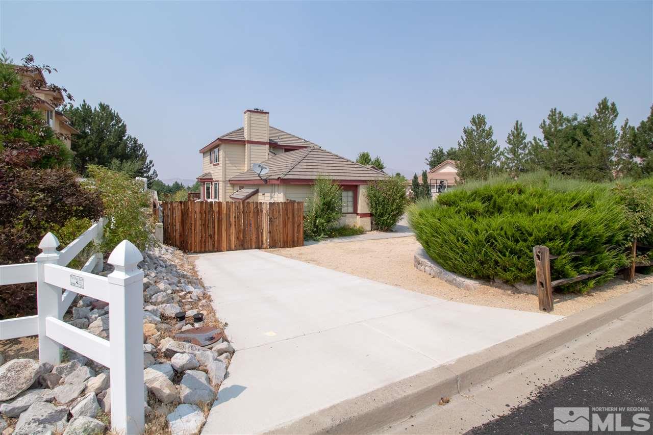 13335 Rim Rock Drive Reno, NV 89521 - Photo 25 of 25 a front view of a house with a yard and garage