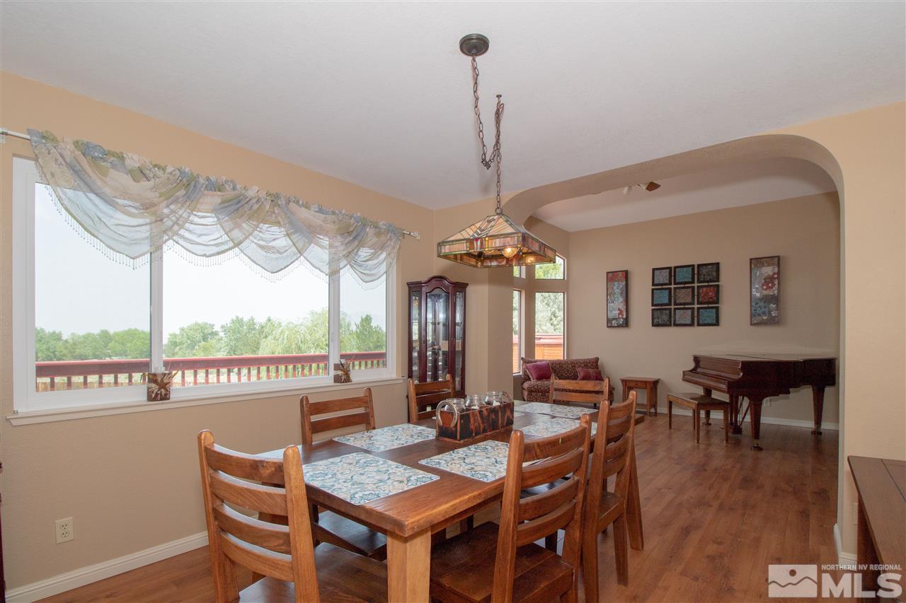 13335 Rim Rock Drive Reno, NV 89521 - Photo 4 of 25 a view of a dining room with furniture window and wooden floor