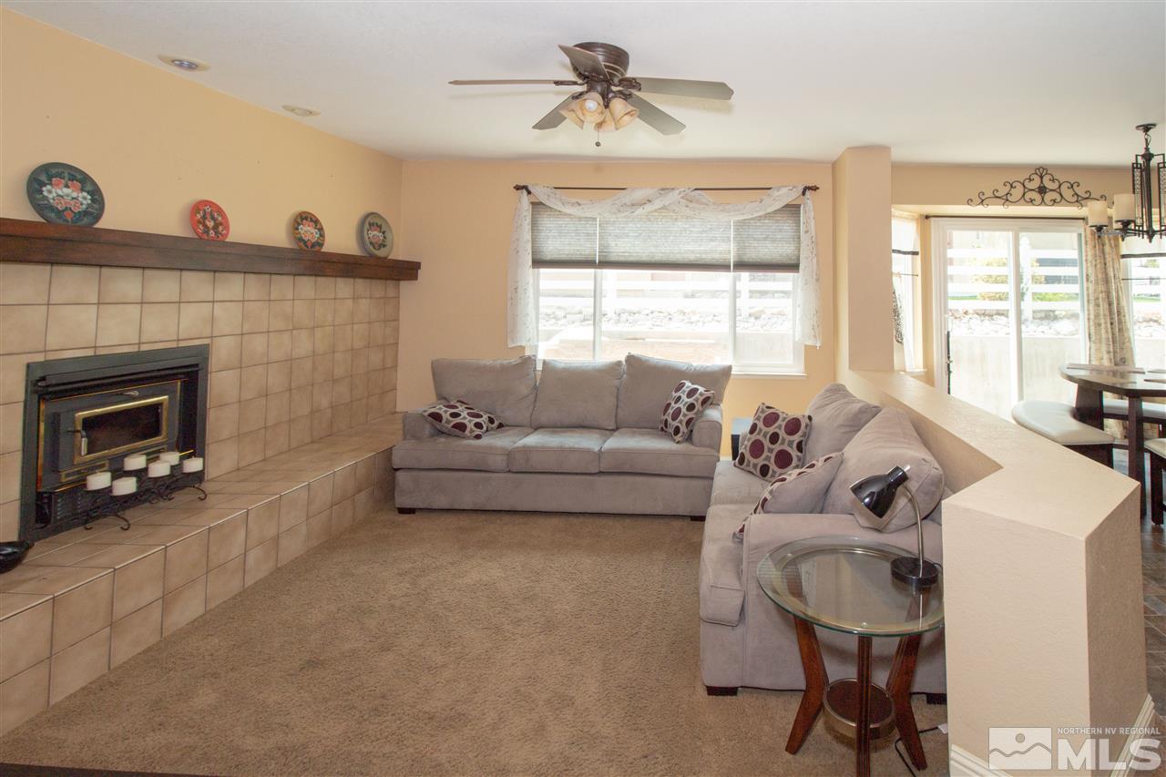13335 Rim Rock Drive Reno, NV 89521 - Photo 8 of 25 a living room with furniture and a fireplace