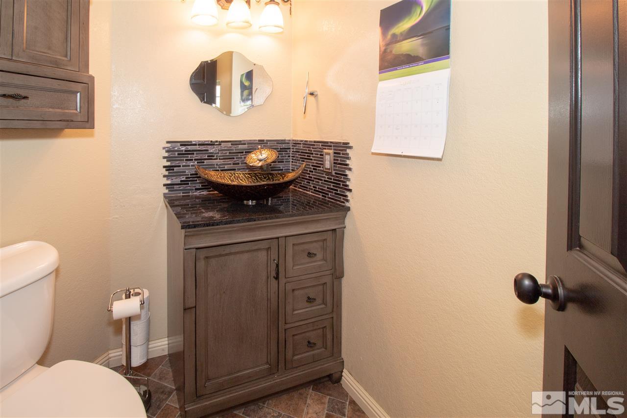13335 Rim Rock Drive Reno, NV 89521 - Photo 10 of 25 a bathroom with a toilet and a sink