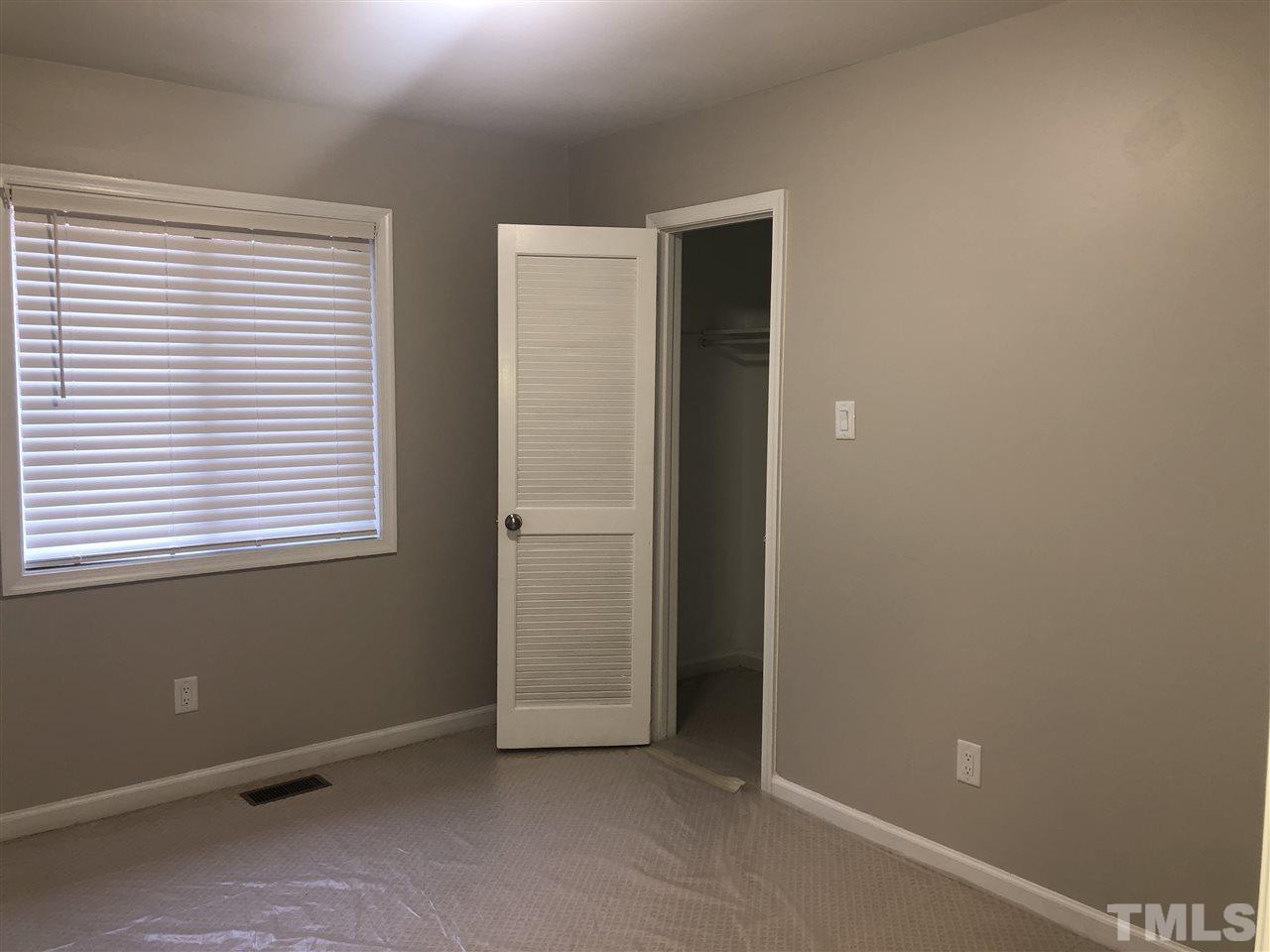 4244 Lake Ridge Drive, Unit 12B Raleigh, NC 27604 - Photo 11 of 28 an empty room with windows