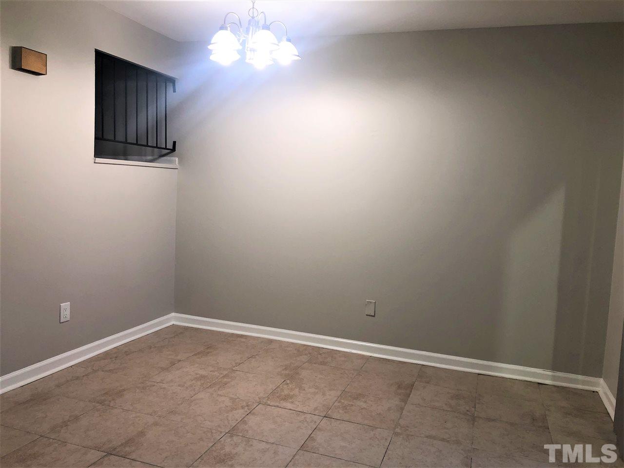 4244 Lake Ridge Drive, Unit 12B Raleigh, NC 27604 - Photo 13 of 28 a view of an empty room with window