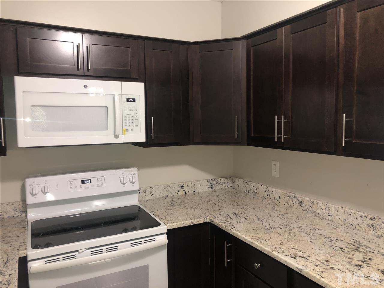4244 Lake Ridge Drive, Unit 12B Raleigh, NC 27604 - Photo 16 of 28 a utility room with dryer and washer