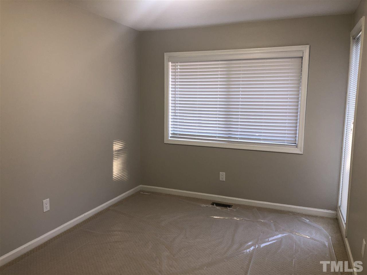 4244 Lake Ridge Drive, Unit 12B Raleigh, NC 27604 - Photo 20 of 28 a view of an empty room with a window