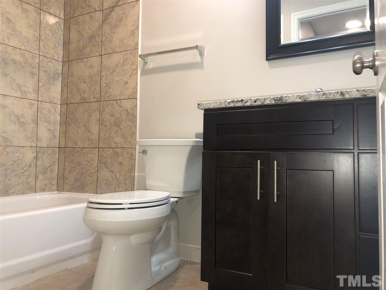 4244 Lake Ridge Drive, Unit 12B Raleigh, NC 27604 - Photo 22 of 28 a bathroom with a sink and a toilet