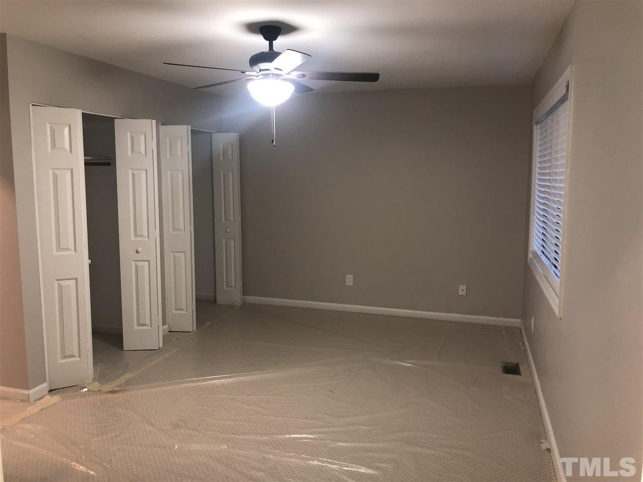 4244 Lake Ridge Drive, Unit 12B Raleigh, NC 27604 - Photo 10 of 28 wooden floor in an empty room