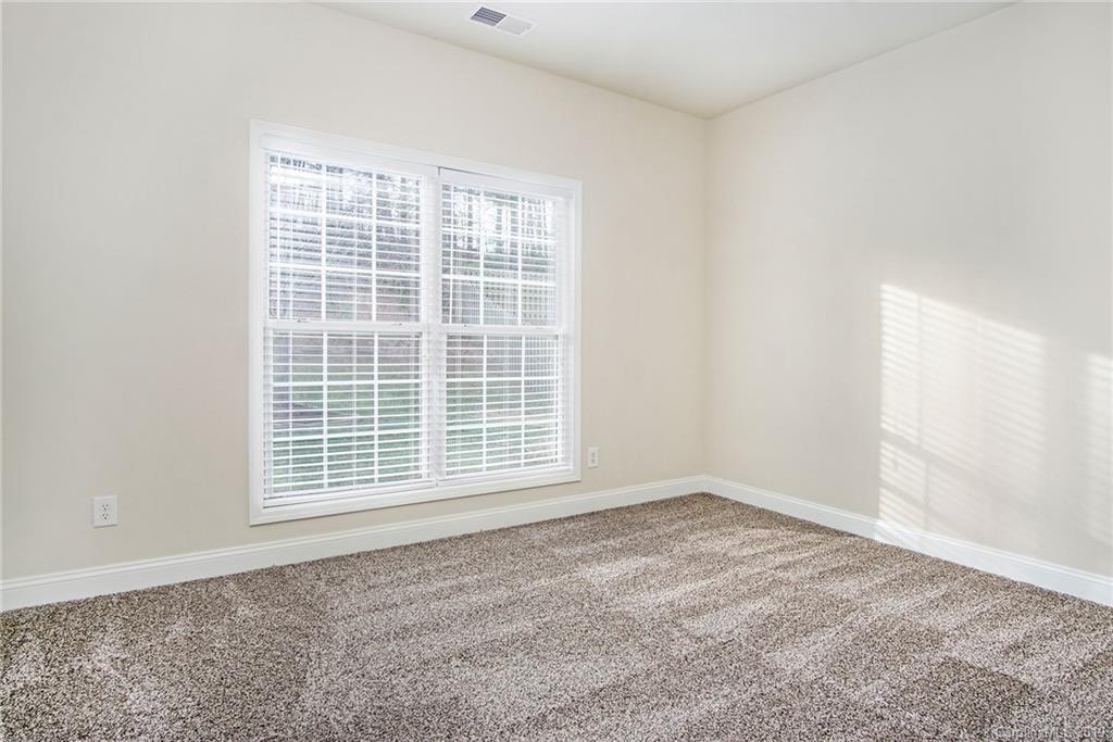 3727 Burnage Hall Road Harrisburg, NC 28075 - Photo 12 of 21 an empty room with a window