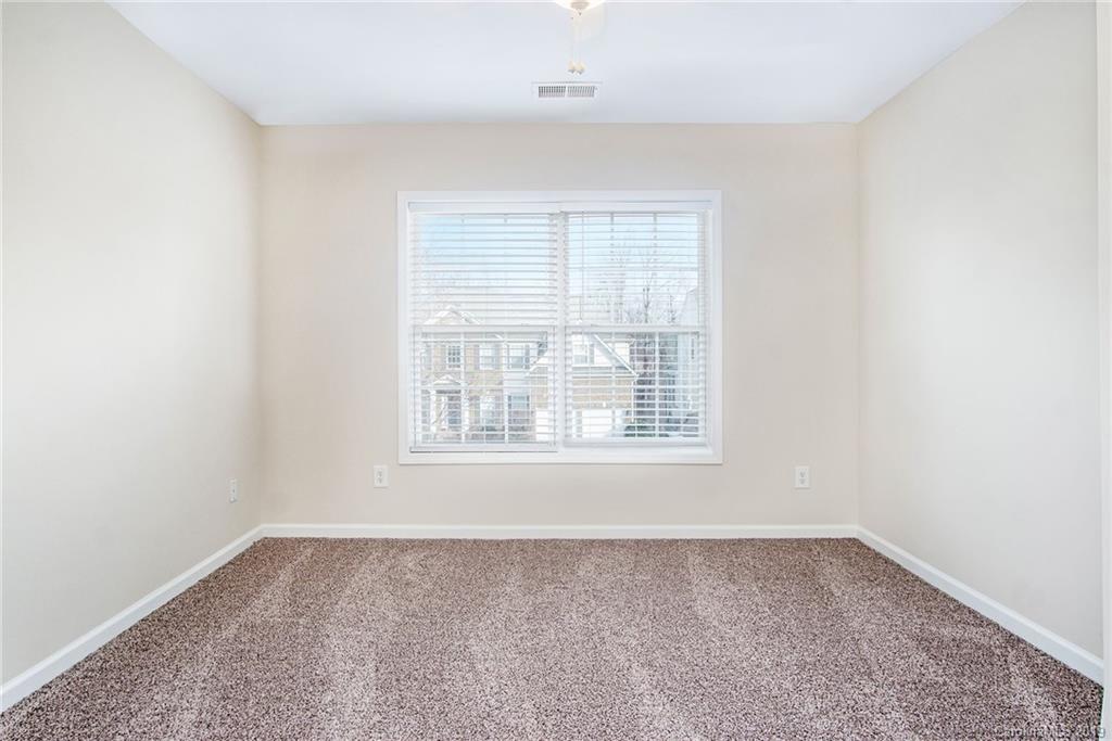 3727 Burnage Hall Road Harrisburg, NC 28075 - Photo 18 of 21 an empty room with a window