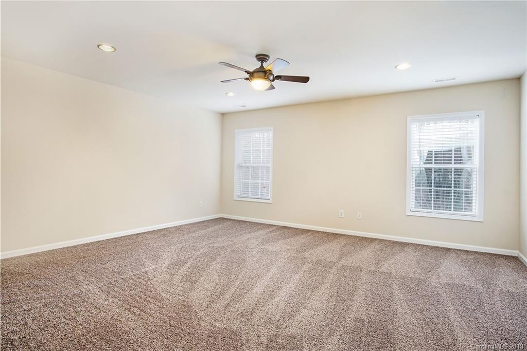 3727 Burnage Hall Road Harrisburg, NC 28075 - Photo 19 of 21 a view of an empty room with a window