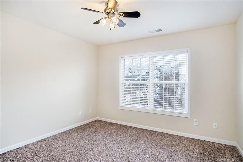 3727 Burnage Hall Road Harrisburg, NC 28075 - Photo 21 of 21 a view of an empty room with a window
