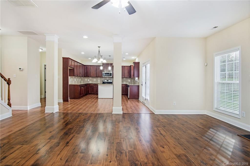 3727 Burnage Hall Road Harrisburg, NC 28075 - Photo 9 of 21 a view of kitchen and hall with wooden floor