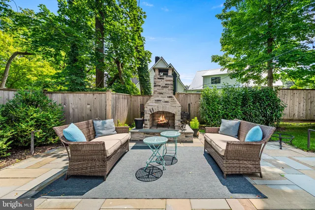 swimming pool with outdoor seating and green space