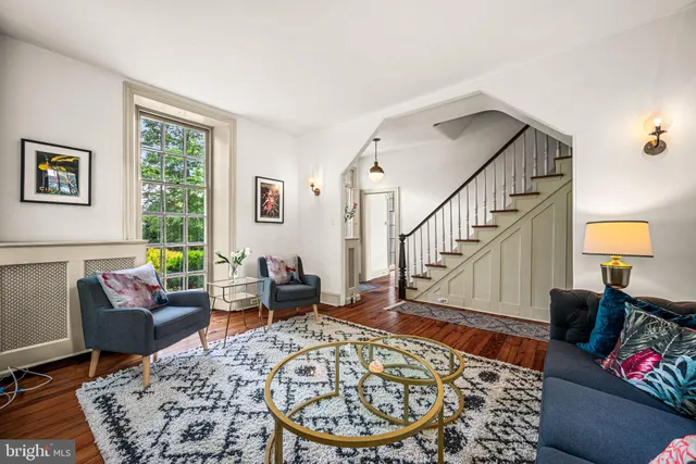 a living room with furniture and a rug