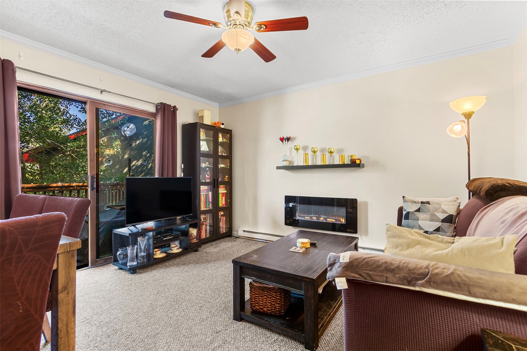 304 Illinois Gulch Road, Unit 204 Breckenridge, CO 80424 - Photo 1 of 13 a living room with furniture and a flat screen tv