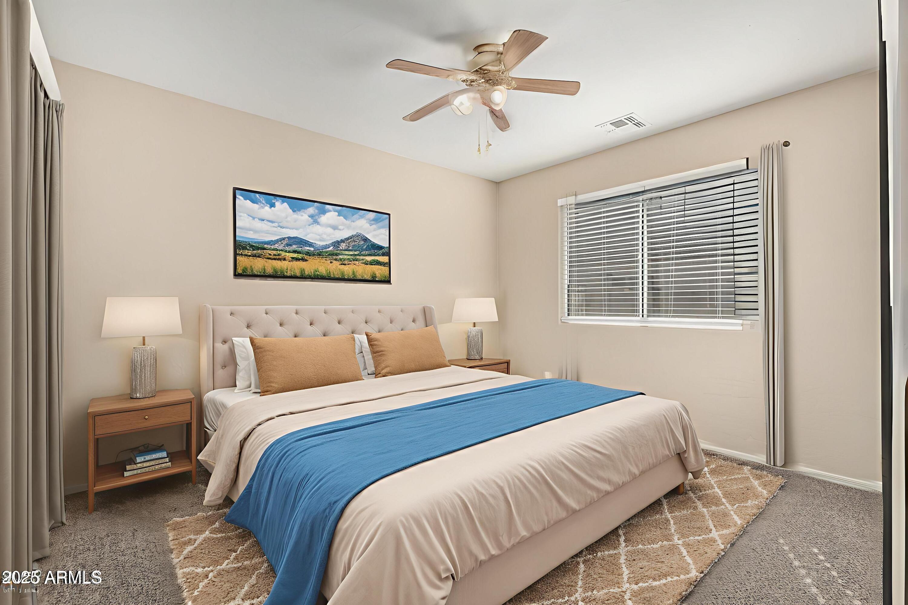 2264 South Belair Road Apache Junction, AZ 85119 - Photo 14 of 19 a bedroom with a bed and a painting on the wall