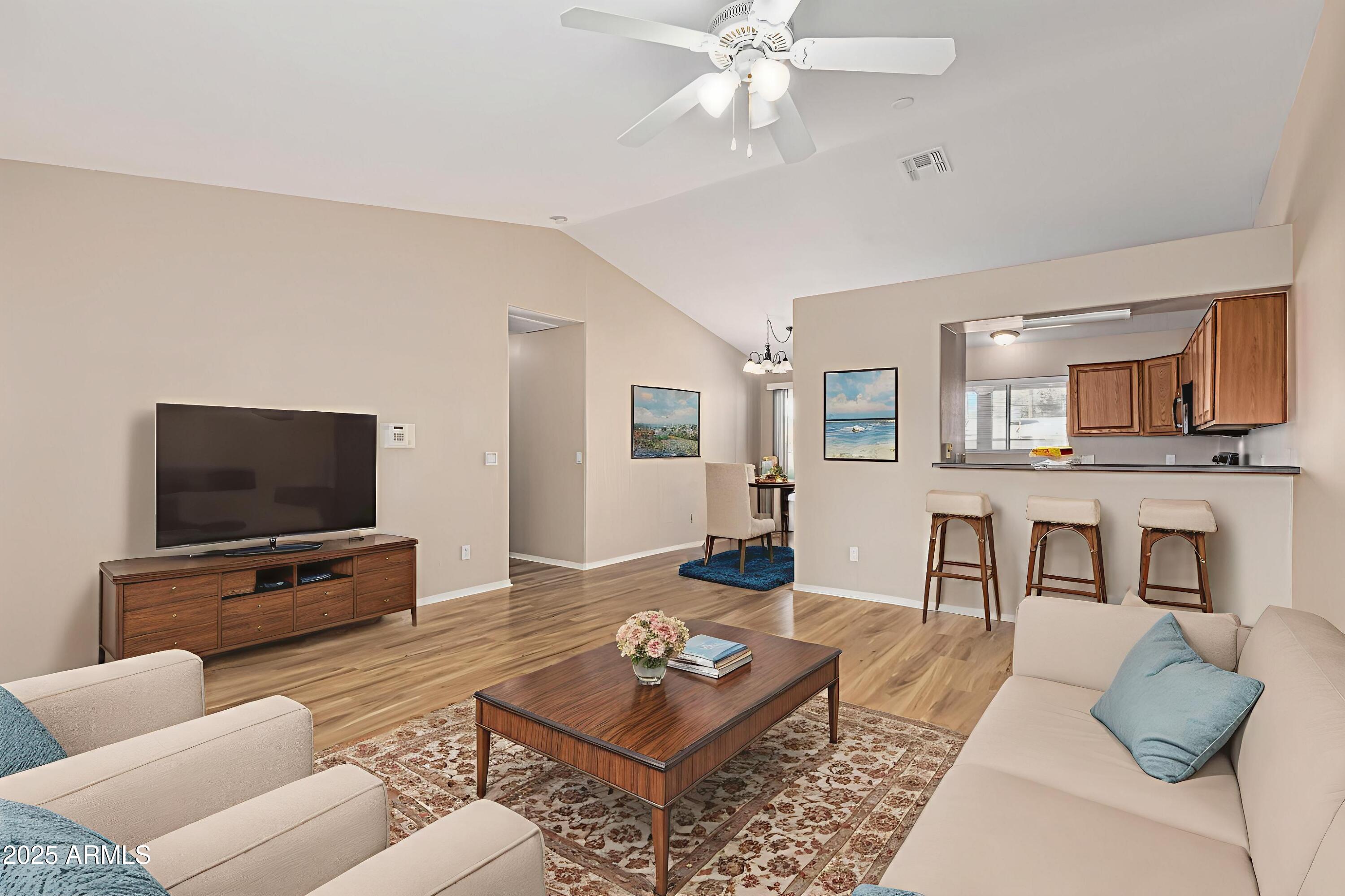 2264 South Belair Road Apache Junction, AZ 85119 - Photo 4 of 19 a living room with furniture and a flat screen tv