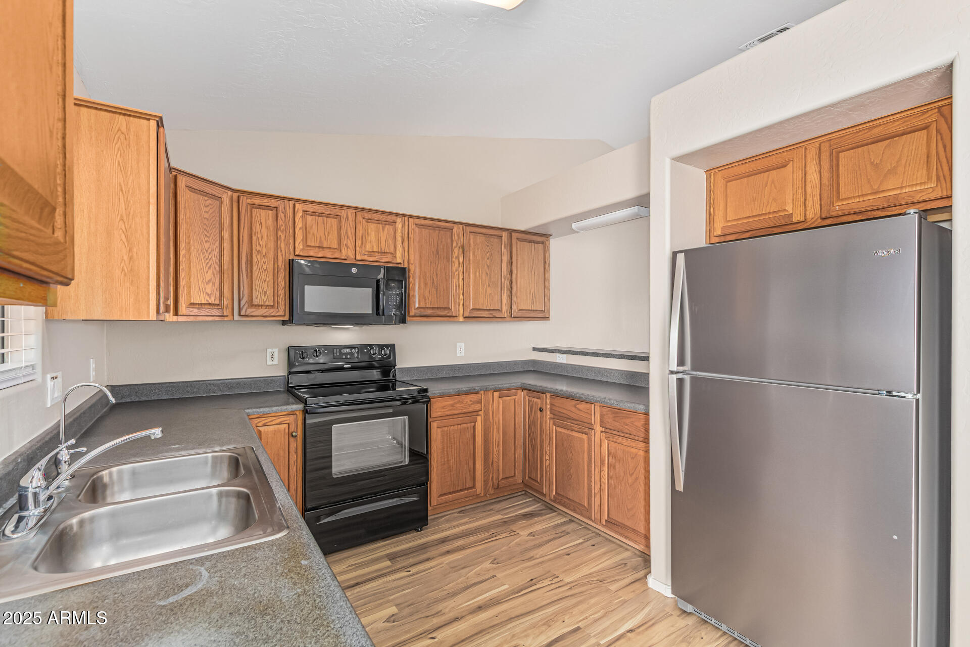 2264 South Belair Road Apache Junction, AZ 85119 - Photo 8 of 19 a kitchen with a refrigerator stove and sink